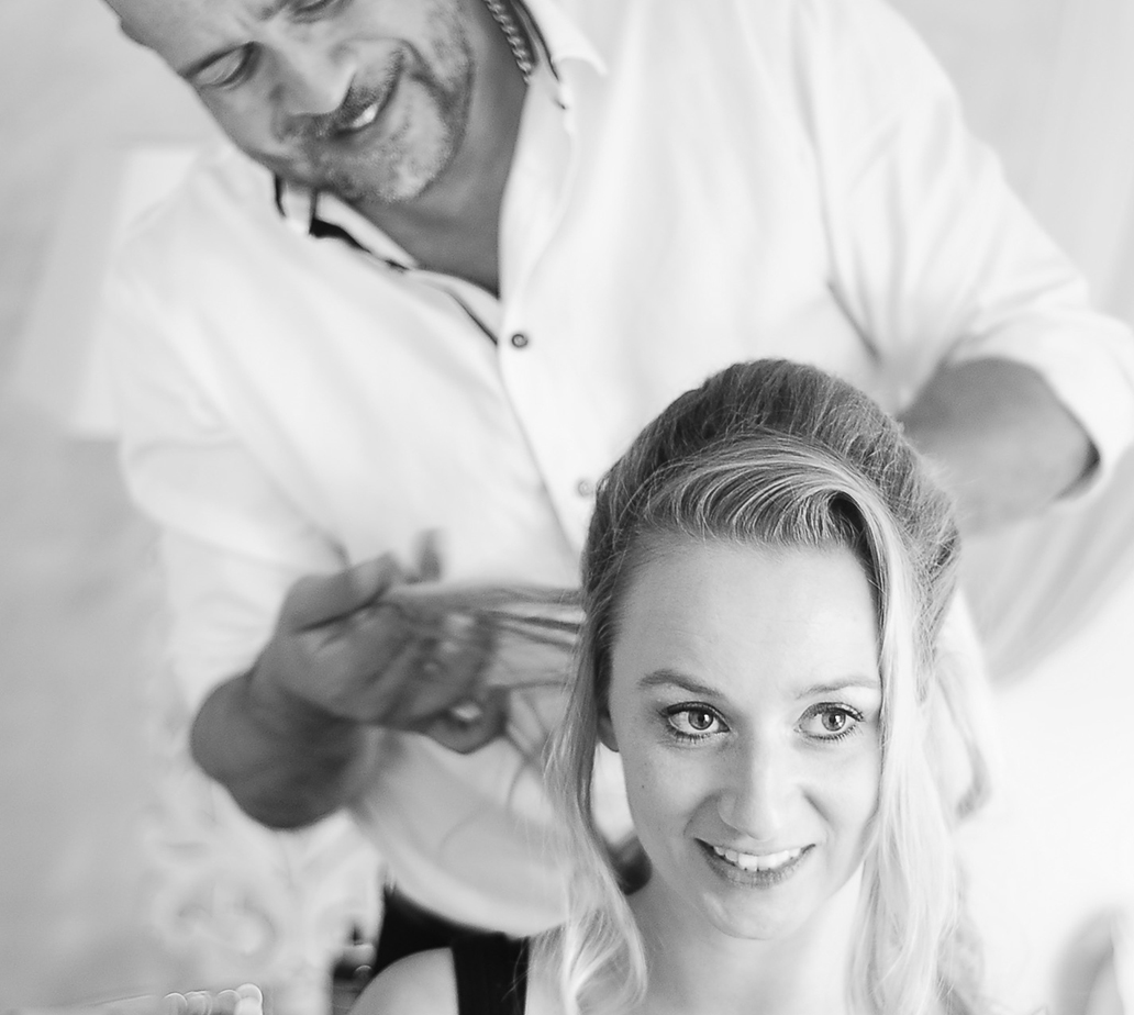 Jimmy Ospina styling a client at his studio